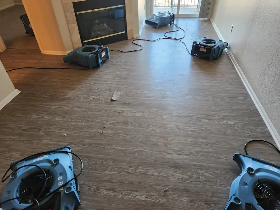 Air movers and a dehumidifier drying a water damaged Rancho Mirage home