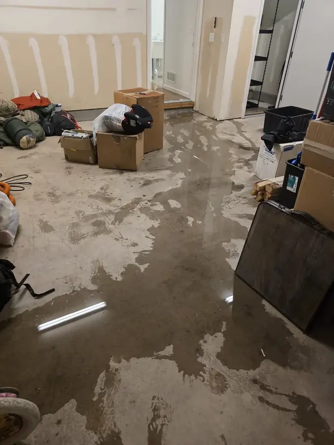 Irrigation line overflow flooding against a desert home foundation